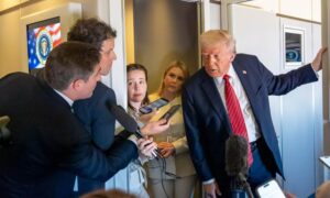 US President Donald Trump speaking with reporters aboard the plane en route to Qatar - May 14, 2025 (Associated Press)